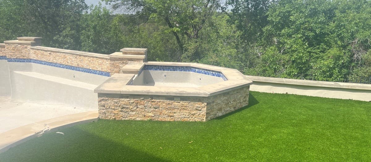 Artificial turf installation steps showing base compaction, seaming technique, and infill distribution