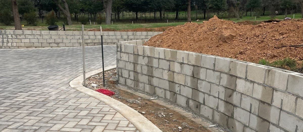 Complete paver patio installation guide — excavation, base prep, bedding sand, and paver layout steps