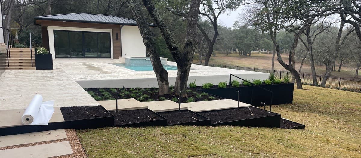 Custom steel fence fabrication and installation — post setting, panel welding, and powder coat finish