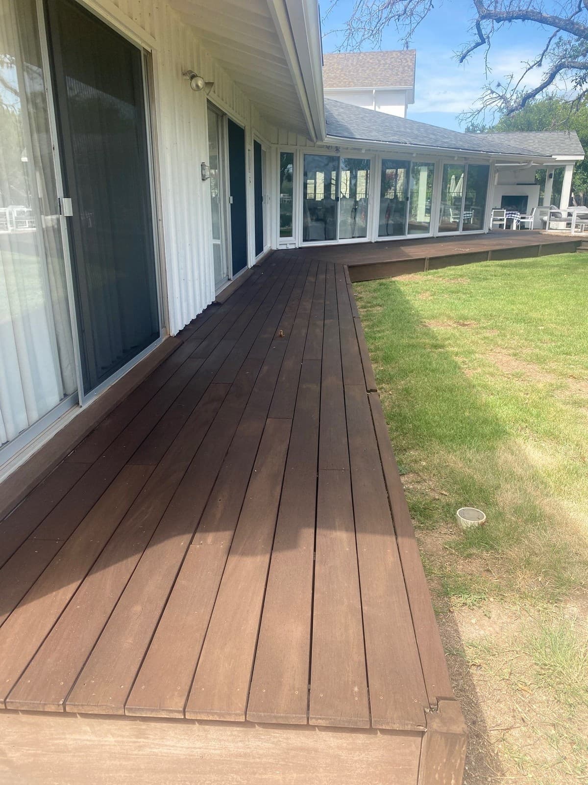 Deck and patio comparison chart showing construction cost per square foot, lifespan, and maintenance requirements