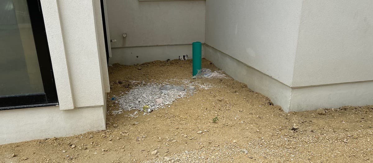 Drainage installation before hardscape construction — correct sequencing of French drains and catch basins