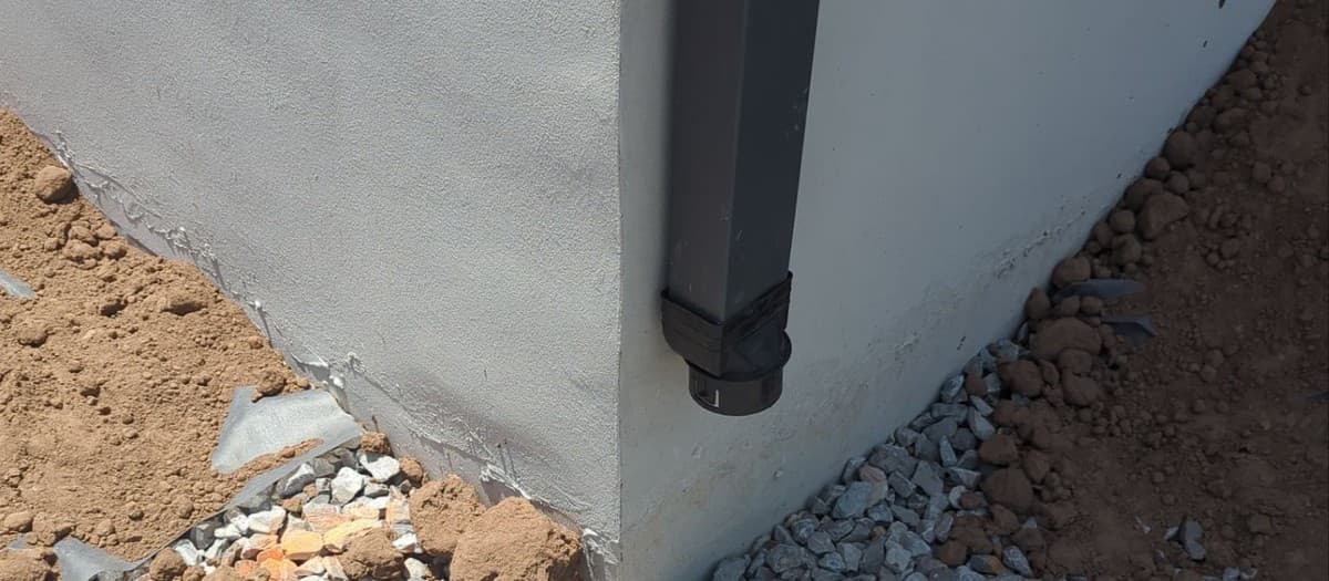 Yard drainage problem solutions — French drain, regrading, and catch basin options for standing water