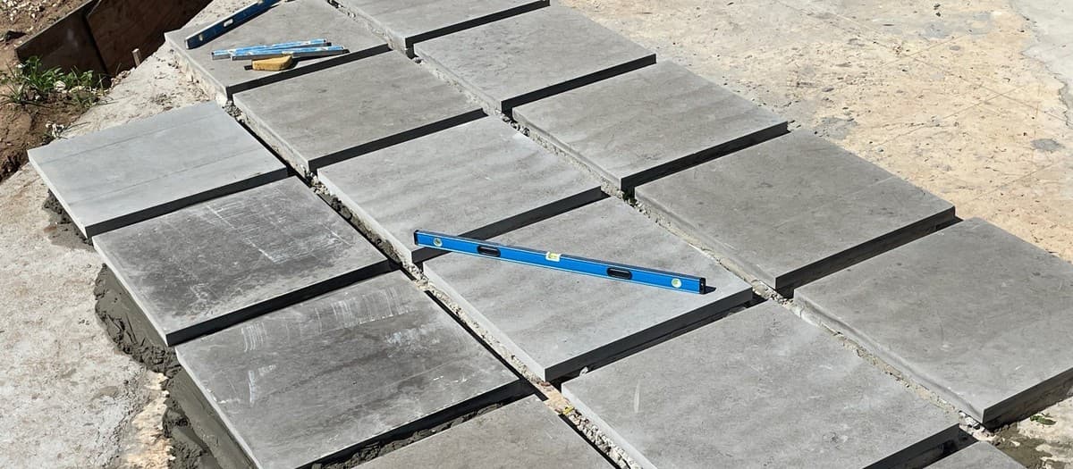 Paver base depth guide — how deep to excavate for foot traffic vs vehicle load vs freeze-thaw climates