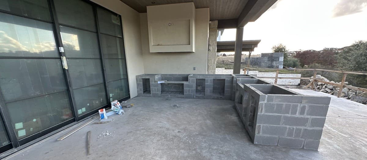 Outdoor kitchen cost estimating — masonry, appliances, countertop, plumbing, and electrical breakdown