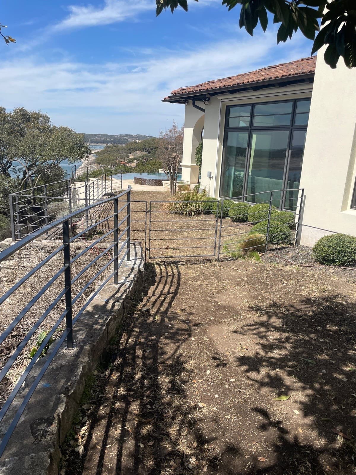 Steel railing estimating line items: posts, pickets, top rail, base plates, welds, and powder coating
