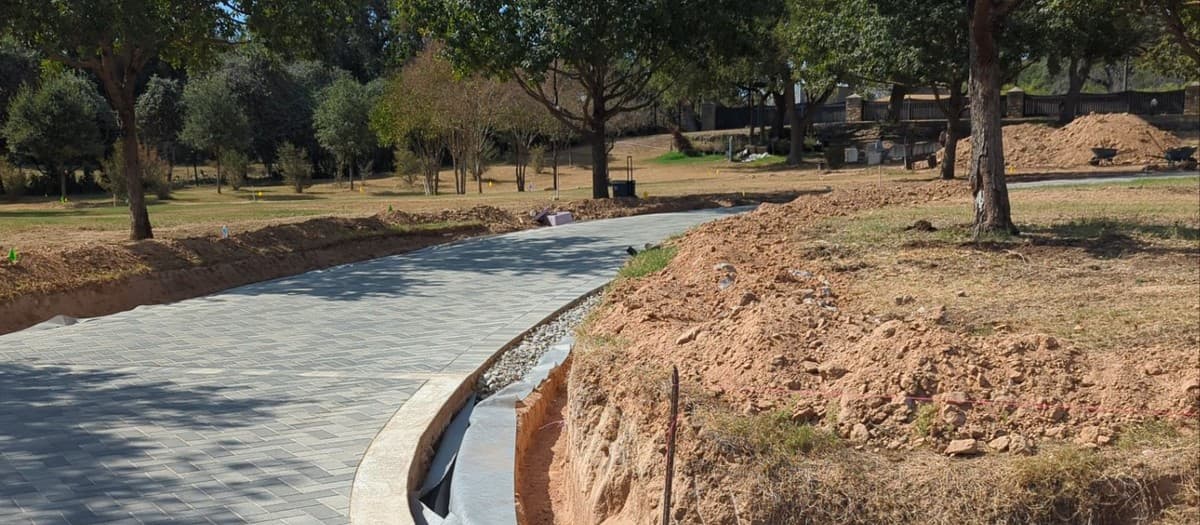 French drain installation that actually works — proper slope, perforation direction, and outlet design