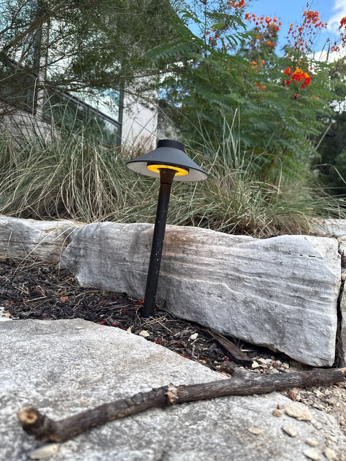 Landscape lighting zone layout showing path lights, uplights, and spotlights with transformer wire runs