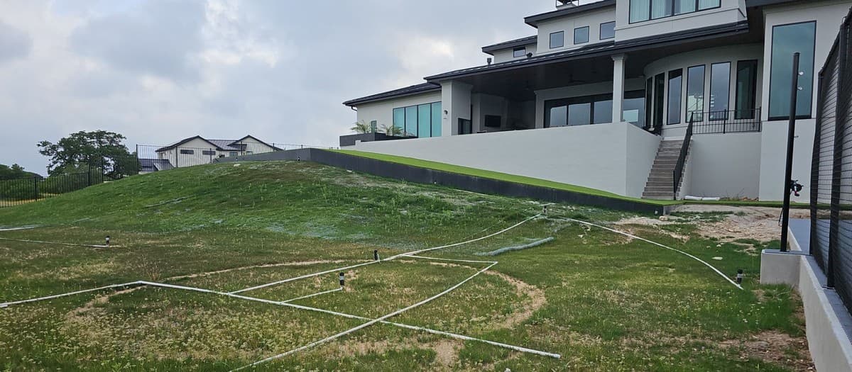 Irrigation installation timing — when in the project sequence to install heads, valves, and controller