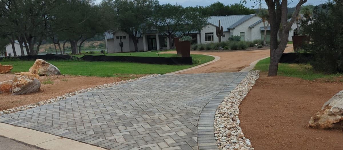 Landscape designs that survive Central Texas heat — drought-tolerant plants and efficient irrigation systems