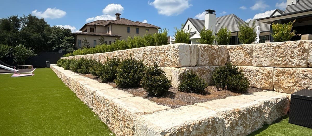Natural turf installation — grading, soil preparation, sod installation, and establishment watering schedule