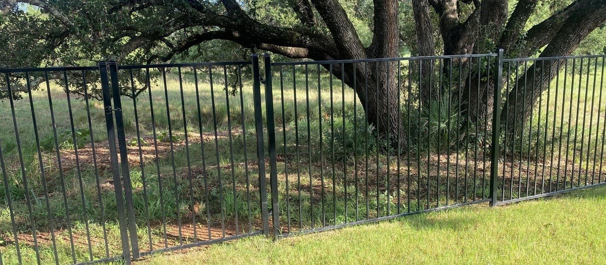 Ornamental iron vs steel fencing cost comparison — material quality, fabrication, and installation pricing