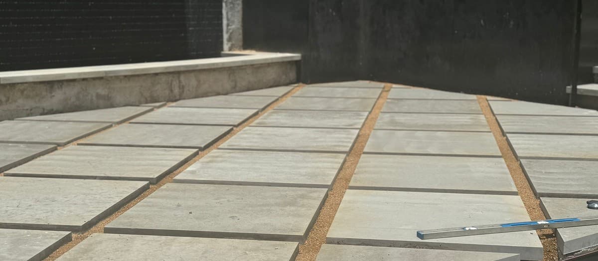 Scoping a paver patio proposal with detailed line items — materials, base, edging, and labor breakdown