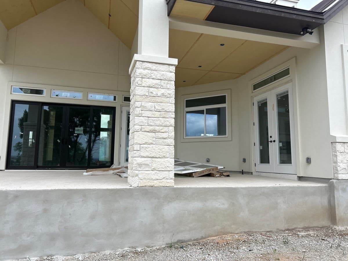 Outdoor living proposal showing patio, fireplace, kitchen, and lighting phases with individual pricing