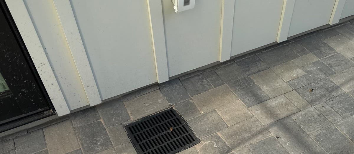 Slot drain vs French drain vs catch basin comparison — application, capacity, and cost for landscape drainage