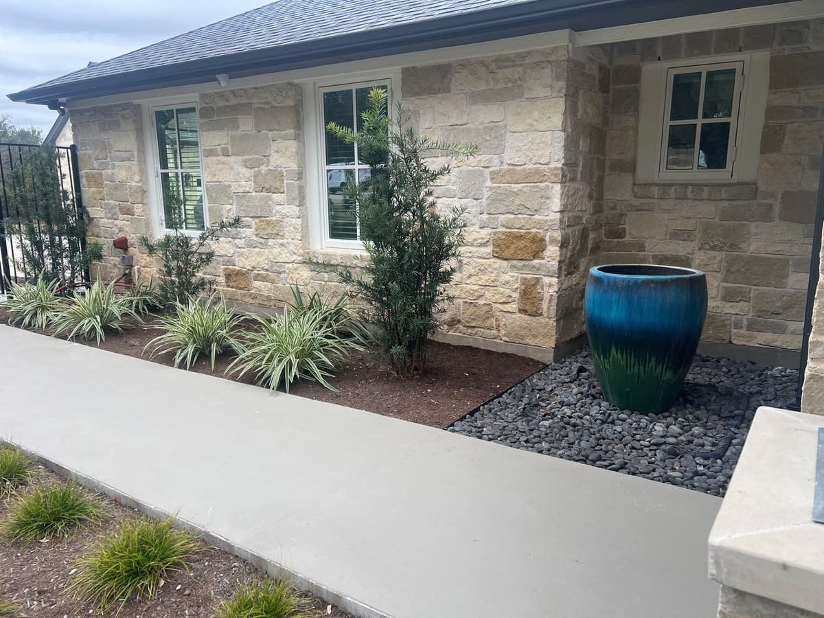 Steel edging installation detail showing trench depth, stake spacing, and corner bend technique