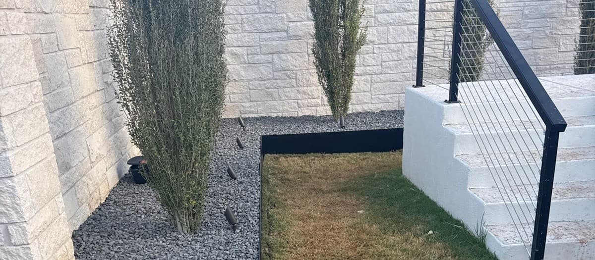 Steel landscape edging installation — trench depth, spike spacing, and joint connection for clean bed lines