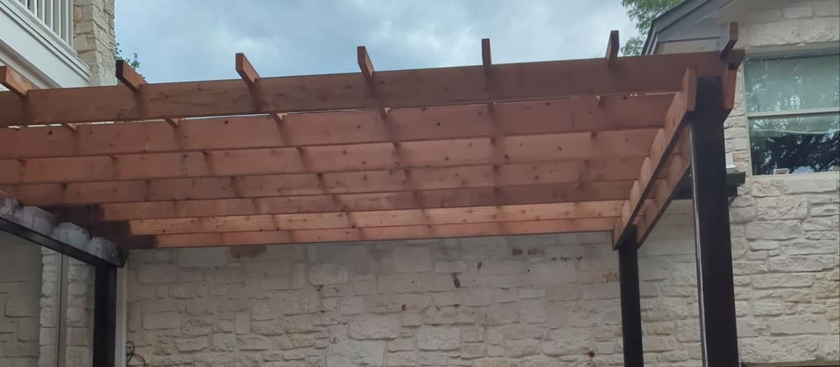 Steel vs wood vs aluminum pergola comparison for Central Texas — durability, cost, and maintenance in heat