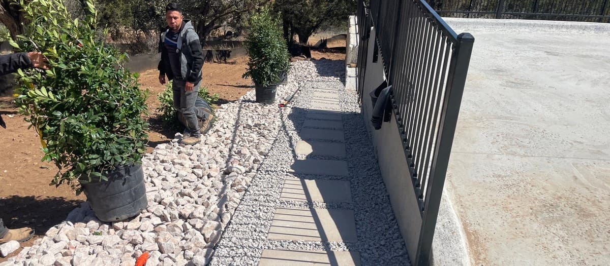 Stepping stone path installation — stone selection, base preparation, and spacing for natural-looking paths